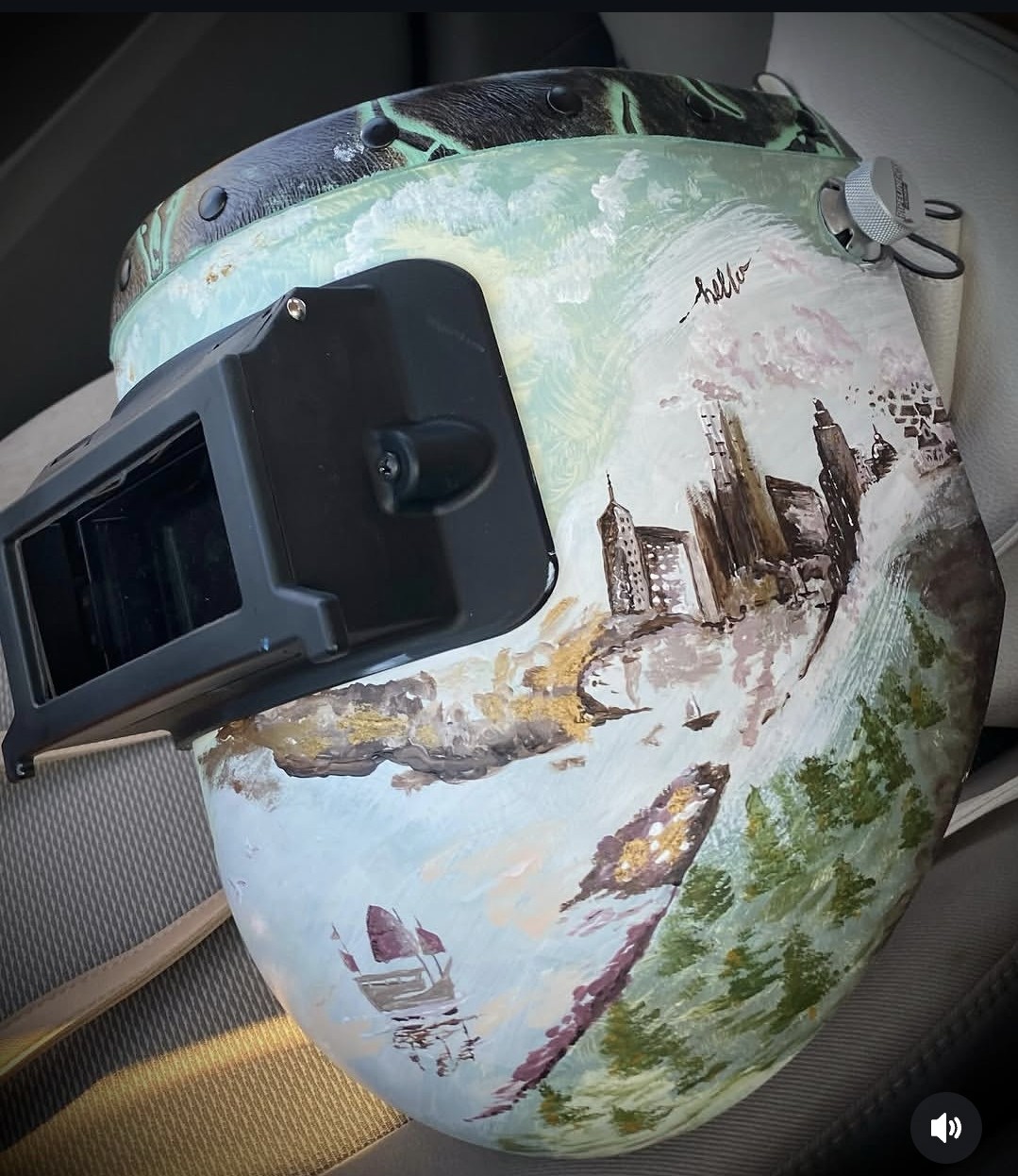 Painted welding helmet with landscape imagery