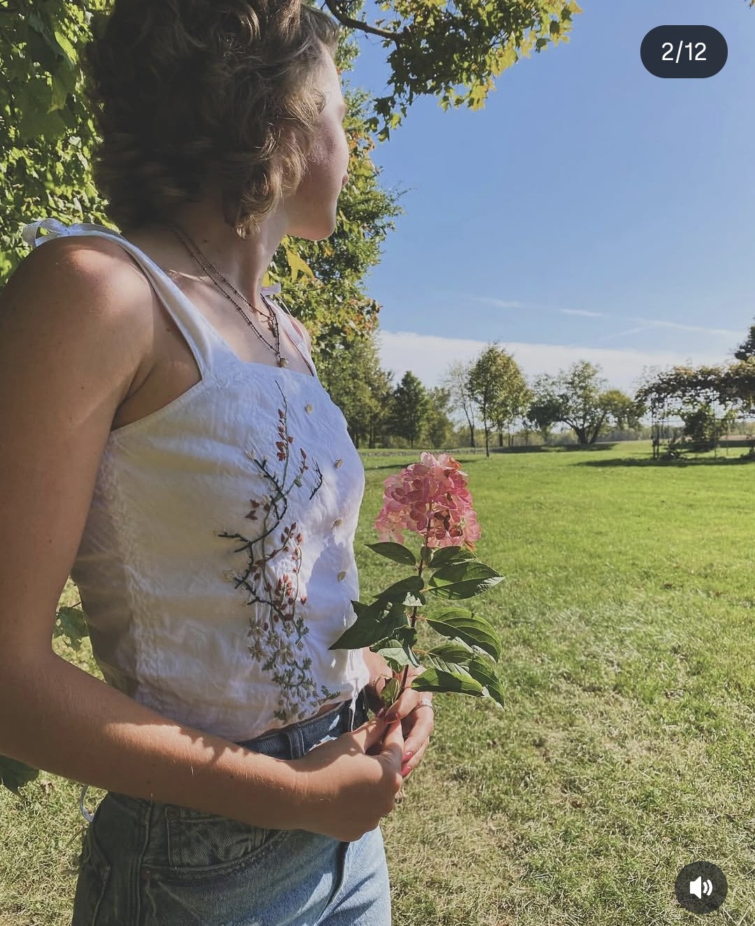 Hand embroidered white top with floral details